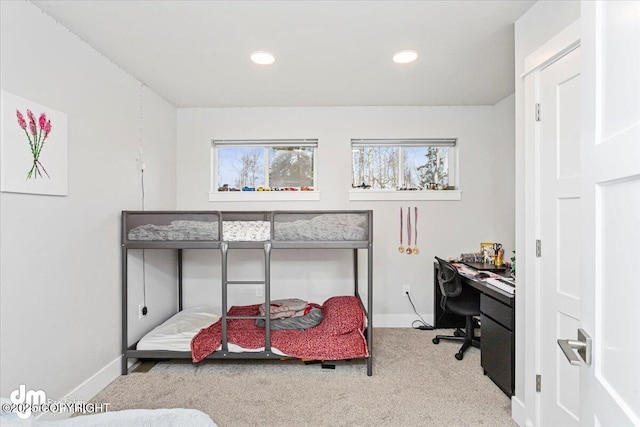 carpeted bedroom featuring recessed lighting and baseboards