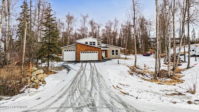 view of front of house with a garage and stone siding