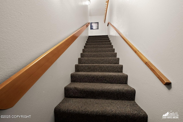 stairway with a textured wall