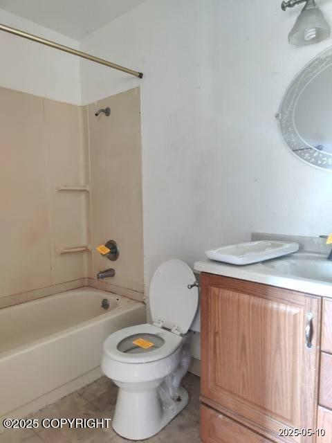 7811 Kiana Cir, Anchorage, AK 99507 - bathroom with vanity, toilet, shower / washtub combination, and tile patterned floors