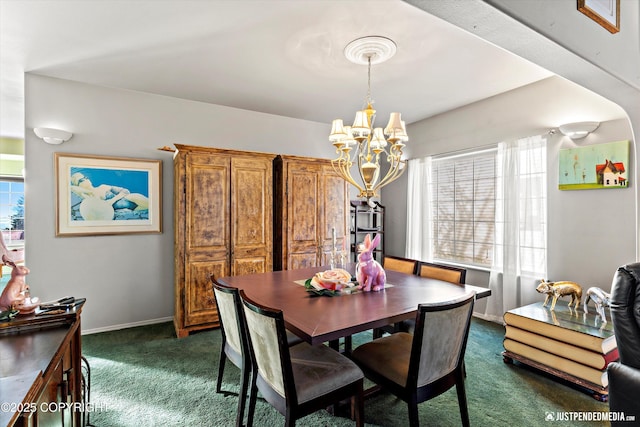 dining room with baseboards, dark colored carpet, and a notable chandelier