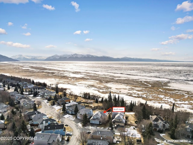 drone / aerial view featuring a residential view and a mountain view