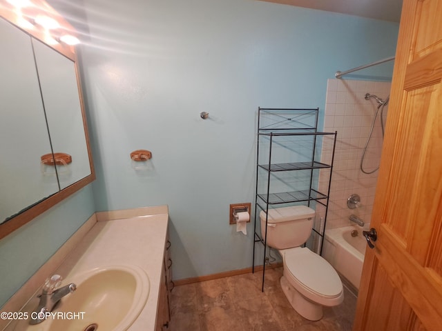 bathroom featuring shower / bath combination, vanity, toilet, and baseboards