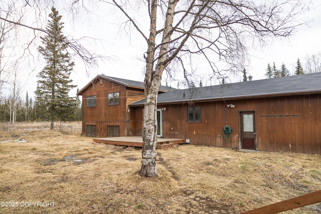 rear view of house with a wooden deck