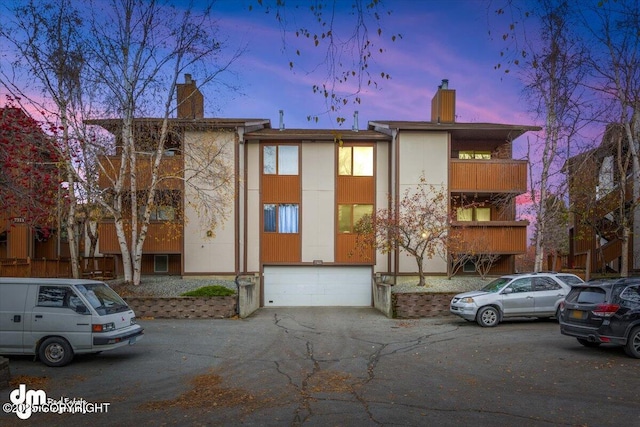 view of property at dusk