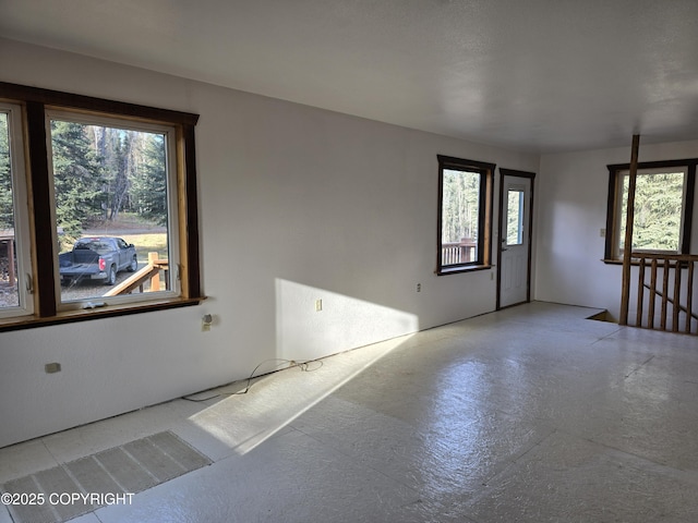 empty room featuring a wealth of natural light