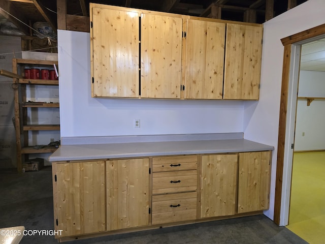 kitchen with light countertops and light brown cabinets