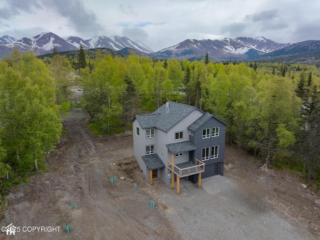 14311 Pickett St, Anchorage, AK 99516 - aerial view of property and surrounding area with a mountain backdrop and a forest
