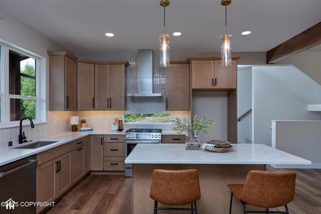 14311 Pickett St, Anchorage, AK 99516 - kitchen with stainless steel appliances, wall chimney range hood, decorative backsplash, dark wood-style floors, and light stone counters