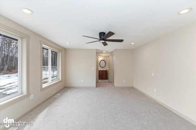 empty room featuring recessed lighting, baseboards, and carpet floors