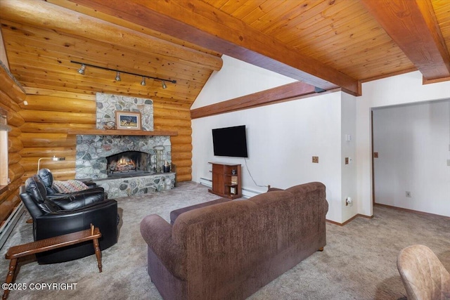 carpeted living area featuring vaulted ceiling with beams, a stone fireplace, wood ceiling, rustic walls, and rail lighting