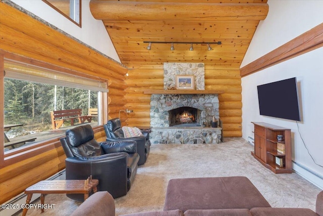 living area featuring rail lighting, log walls, carpet flooring, a fireplace, and high vaulted ceiling