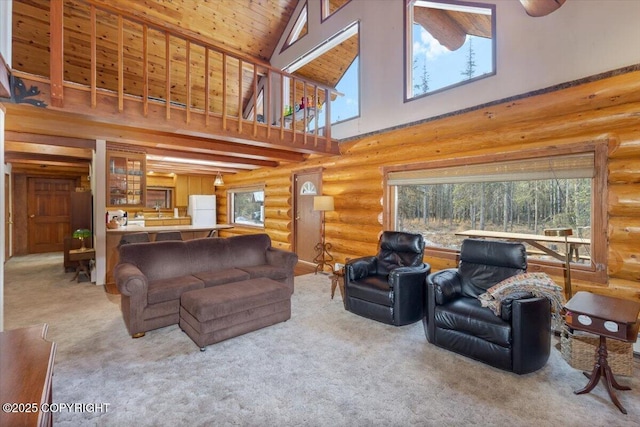 living room with high vaulted ceiling, carpet, wood ceiling, and a healthy amount of sunlight