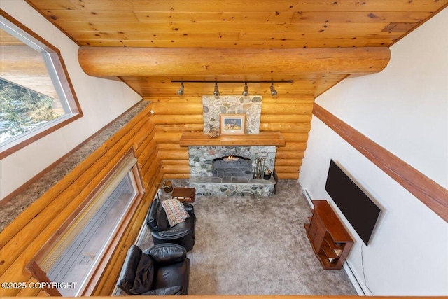 carpeted living area featuring wooden ceiling, rustic walls, a fireplace, and beam ceiling