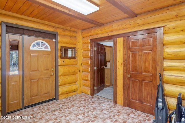 entryway featuring brick floor, wood ceiling, and beam ceiling