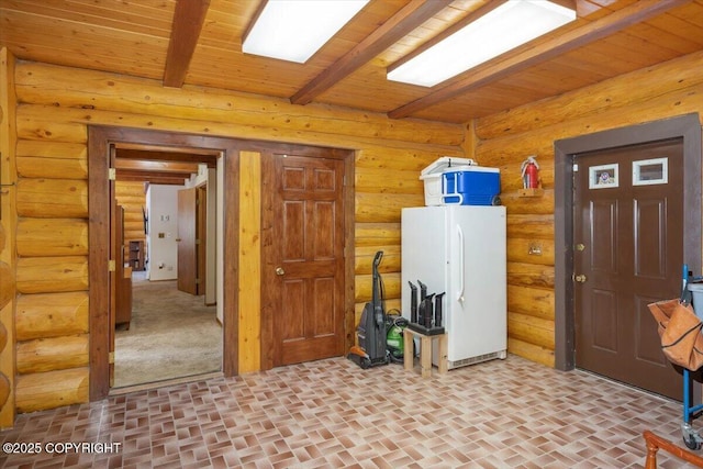 clothes washing area with brick floor, wooden ceiling, and rustic walls