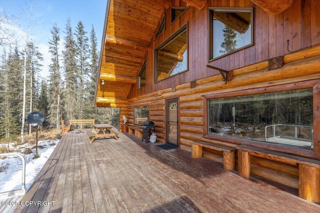 wooden terrace featuring a grill