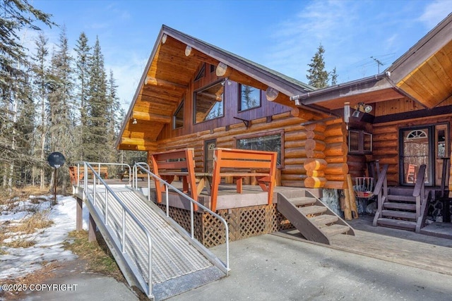 entrance to property with log exterior