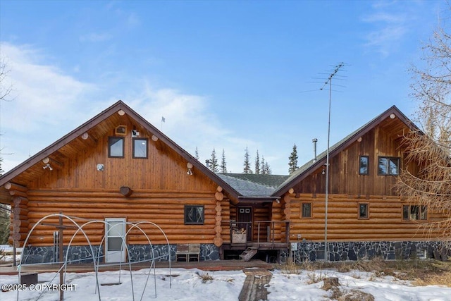 log-style house featuring log siding