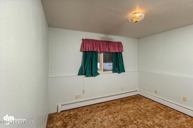 unfurnished room featuring a baseboard radiator and a textured ceiling