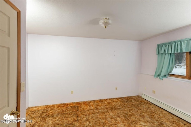 empty room with carpet and baseboard heating