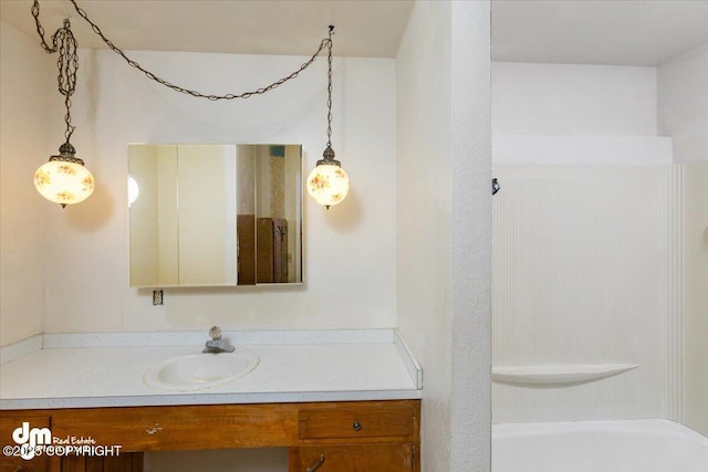 bathroom with a shower, a bath, and vanity