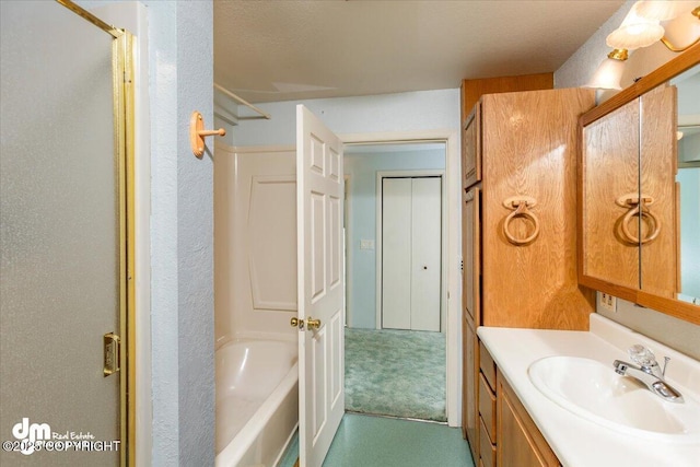 bathroom featuring a tub, vanity, and walk in shower