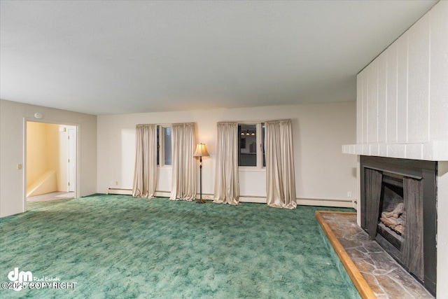 unfurnished living room with a large fireplace, baseboard heating, and carpet flooring