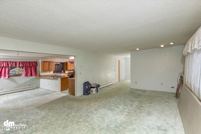 interior space with a textured ceiling, a baseboard radiator, a sink, and light colored carpet