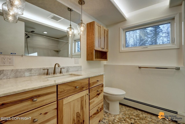 full bath with visible vents, toilet, vanity, a baseboard heating unit, and a shower