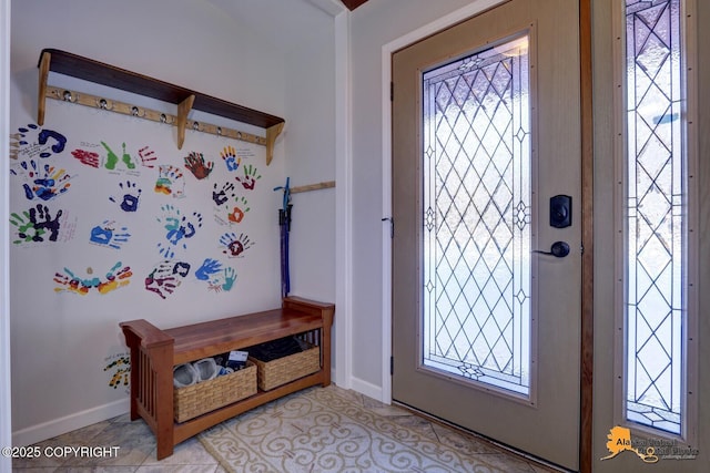 entryway featuring a wealth of natural light and baseboards
