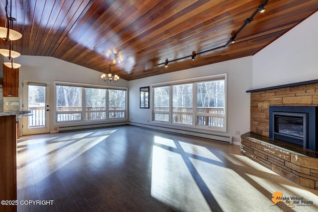 unfurnished living room featuring rail lighting, vaulted ceiling, a healthy amount of sunlight, and wooden ceiling