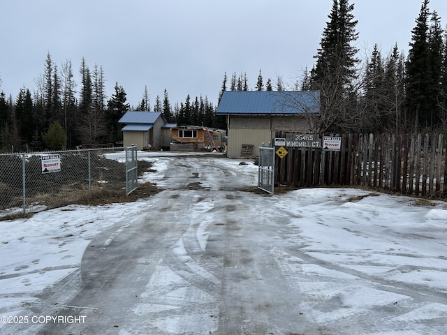 exterior space with driveway and a gated entry