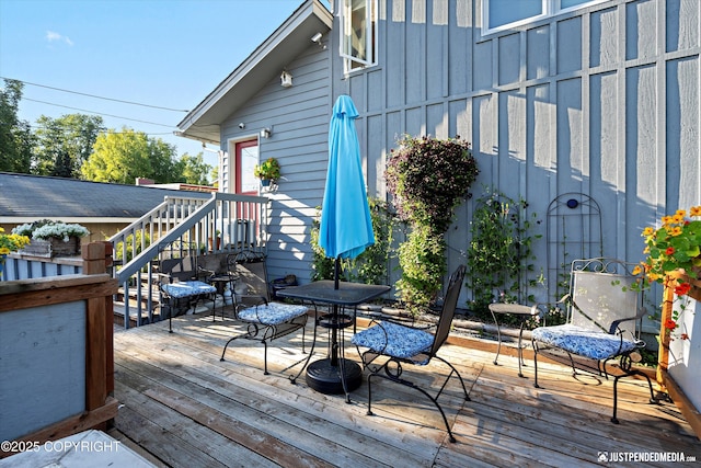 deck with outdoor dining area