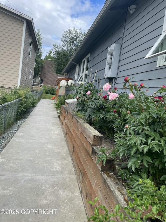 view of side of property with fence