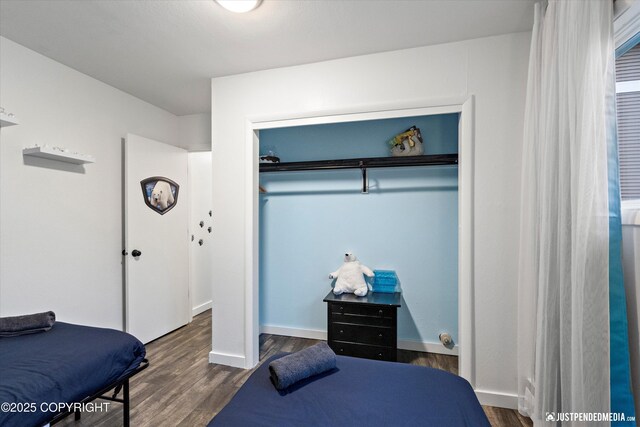 521 N St, Anchorage, AK 99501 - bedroom with baseboards, a closet, and wood finished floors