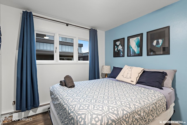 521 N St, Anchorage, AK 99501 - bedroom with wood finished floors and baseboard heating