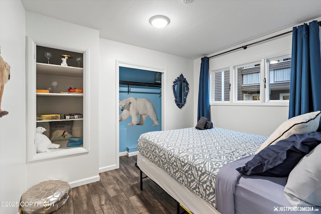 521 N St, Anchorage, AK 99501 - bedroom featuring baseboards, a closet, and dark wood finished floors