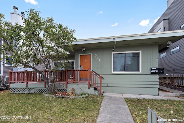 521 N St, Anchorage, AK 99501 - view of front of house featuring a front yard and a deck