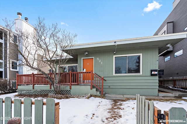 521 N St, Anchorage, AK 99501 - view of front of home featuring fence and a wooden deck