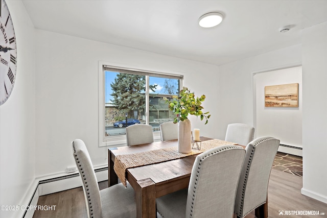 521 N St, Anchorage, AK 99501 - dining space with a baseboard radiator, light wood-type flooring, and baseboards