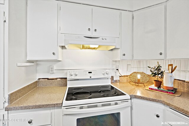 521 N St, Anchorage, AK 99501 - kitchen featuring white cabinetry, white electric range, and under cabinet range hood