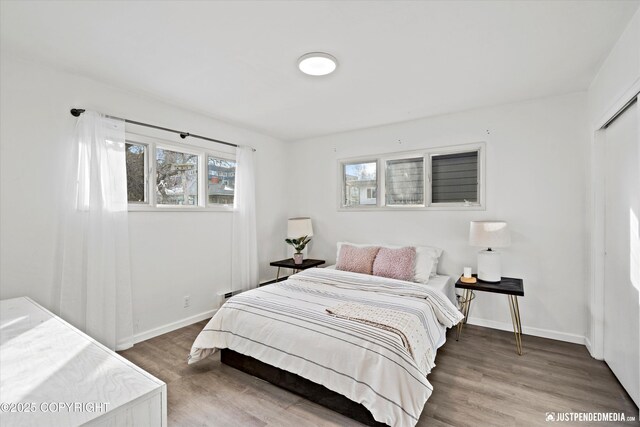 521 N St, Anchorage, AK 99501 - bedroom with baseboards and wood finished floors