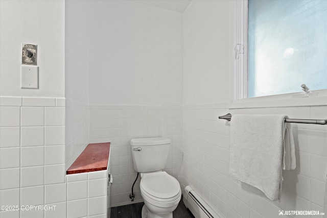 521 N St, Anchorage, AK 99501 - bathroom with toilet, tile walls, and wainscoting