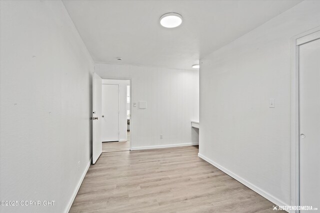 521 N St, Anchorage, AK 99501 - corridor with baseboards and light wood-style floors