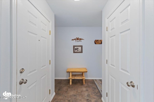 hallway featuring baseboards