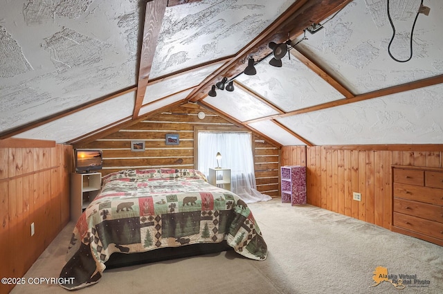 bedroom featuring lofted ceiling with beams, carpet flooring, and wooden walls