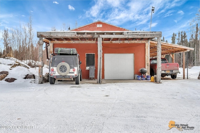 view of snow covered garage