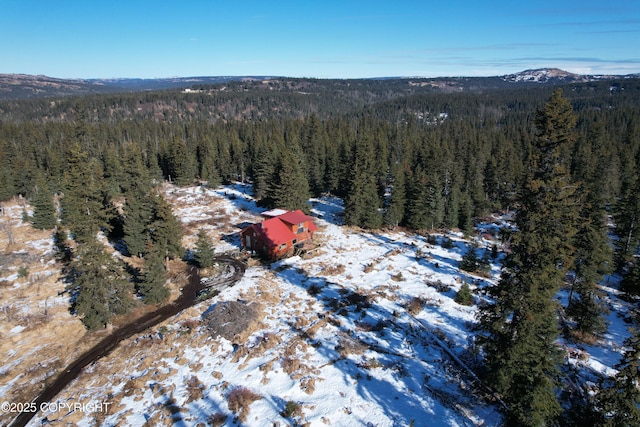 bird's eye view featuring a wooded view