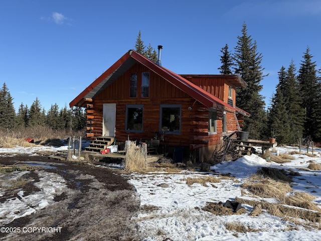 cabin with entry steps and log siding